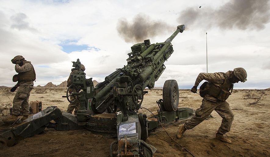 U.S. Marines with Alpha Battery, 1st Battalion, 12th Marines, currently assigned to 3/12, fire the M777-A2 Howitzer down range during Integrated Training Exercise 2-15 at Blacktop Training Area aboard Camp Wilson, Marine Corps Air Ground Combat Center Twentynine Palms, Calif., Jan. 31st, 2015. ITX 2-15, being executed by Special Purpose Marine Air-Ground Task Force 4, is being conducted to enhance the integration and warfighting capability from all elements of the MAGTF. (U.S. Marine Corps photo by Lance Cpl. Aaron S. Patterson/Released)