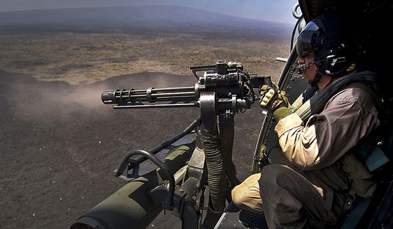 U.S. Marine Corps Cpl. Richard Sippl, UH-1Y Venom, flight crew chief assigned to Marine Light Attack Helicopter Squadron 169 (HMLA-169) fires a 7.62mm GAU-17/A Minigun July 22, 2012, during a live fire combat training mission over the Pohakuloa Training Area, (PTA) Hawaii during Rim of the Pacific (RIMPAC) Exercise 2012. HMLA-169 is part of the aviation combat element of special purpose Marine air-ground task force three. Twenty-two nations, more than 40 ships and submarines, more than 200 aircraft and 25,000 personnel are participating in RIMPAC exercise from Jun. 29 to Aug. 3, in and around the Hawaiian Islands. The world&#39;s largest international maritime exercise, RIMPAC provides a unique training opportunity that helps participants foster and sustain the cooperative relationships that are critical to ensuring the safety of sea lanes and security on the worlds oceans. RIMPAC 2012 is the 23rd exercise in the series that began in 1971.  (U.S. Air Force photo by Tech. Sgt. Michael R. Holzworth)