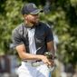 Golden State Warriors guard Stephen Curry tees off at Langston Golf Course in Washington, Monday, Aug. 19, 2019, following a news conference where Curry announced that he would be sponsoring the creation of men&#x27;s and women&#x27;s golf teams at Howard University. (AP Photo/Andrew Harnik)