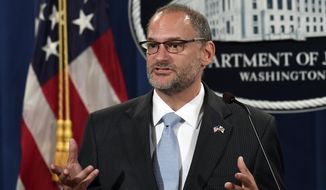 In this July 19, 2019, photo, acting Director of the Bureau of Prisons Hugh Hurwitz speaks during a news conference at the Justice Department in Washington. Hurwitz has been removed from his post more than a week after millionaire financier Jeffrey Epstein took his own life while in federal custody. Attorney General William Barr announced Hugh Hurwitz’s termination Monday, Aug. 19. (AP Photo/Susan Walsh) **FILE**