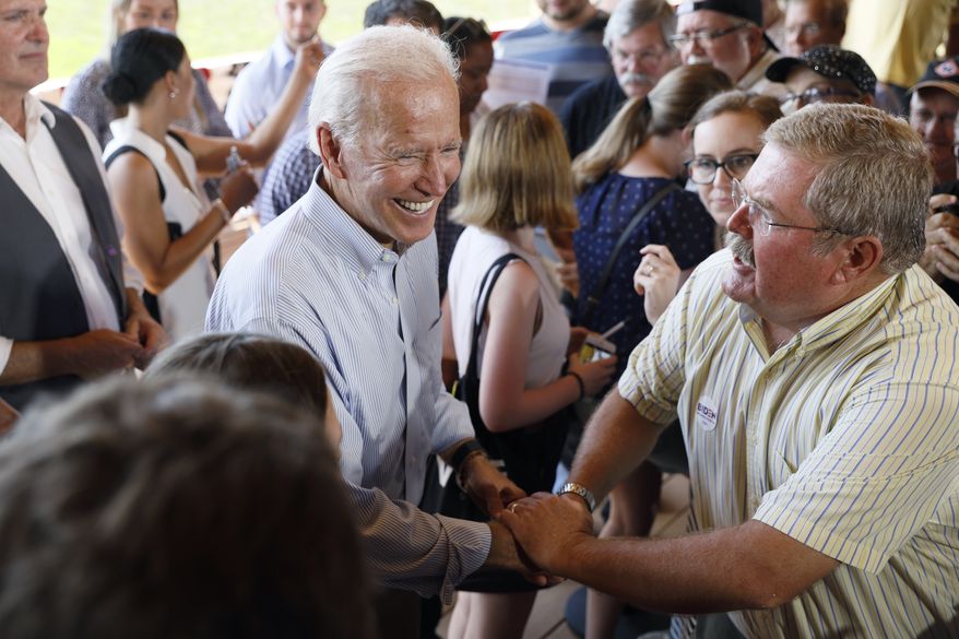 Democratic presidential candidate former Vice President Joe Biden greets audience members during a community event, Tuesday, Aug. 20, 2019, in Prole, Iowa. (AP Photo/Charlie Neibergall)