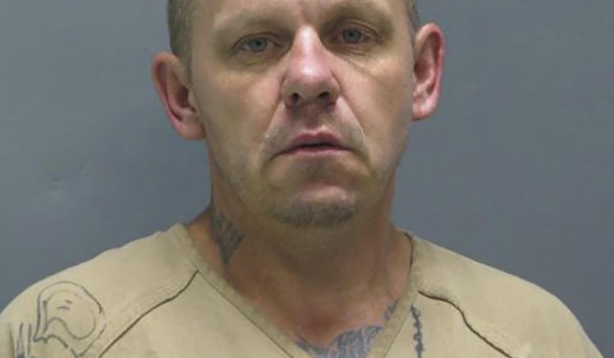 This photo provided by the Liberty County Sheriff's Office shows Clay Sterling Harvey. Officers using tracking dogs are searching for two inmates who escaped from an East Texas jail through a perimeter fence that had been cut. The Liberty County Sheriff's Office says 44-year-old Harvey of Nederland and 23-year-old Chance Marshall Hunt of Beaumont were discovered missing Tuesday morning, Aug. 20, 2019. Capt. Ken DeFoor says a fence on the jail's east side was found cut and appeared to be the escape route. Investigators didn't immediately provide additional information about the damaged fence. (Liberty County Sheriff's Office via AP)