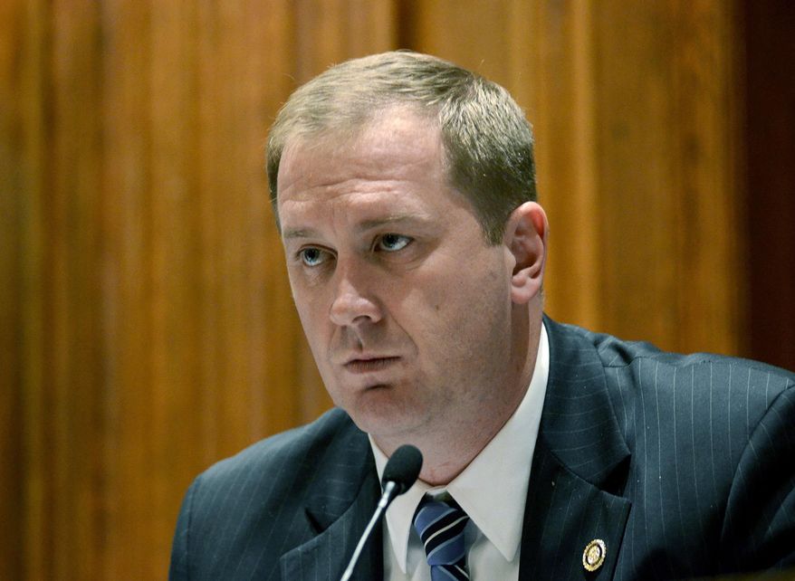 FILE - In this Dec. 3, 2013, file photo, then Missouri Sen. Eric Schmitt, leads a meeting at the Capitol in Jefferson City, Mo. Schmitt, now the state's attorney general, is arguing in a lawsuit that the First Amendment allows him to withhold some records requested by the opposing attorney. Schmitt's office is defending Republican state Rep. Holly Rehder, who is accused by former Scott City Mayor Ron Cummins of defaming him. Cummins' attorney is seeking information about constituents who complained to Rehder's office. (Kile Brewer/The Jefferson City News-Tribune via AP, File)