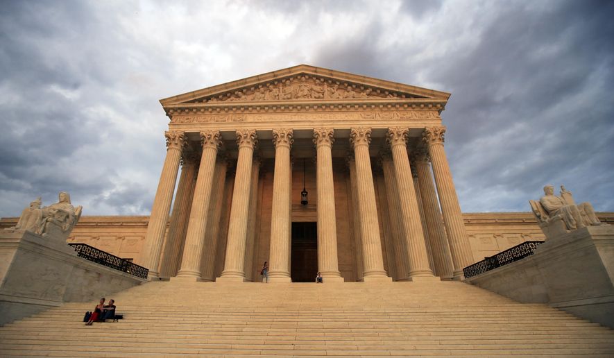 FILE - In this Oct. 18, 2018 file photo, the U.S. Supreme Court is seen at near sunset in Washington. Dozens of legal briefs supporting fired funeral director Aimee Stephens at the Supreme Court use “she” and “her” to refer to the transgender woman. So does the appeals court ruling in favor of Stephens that held that workplace discrimination against transgender people is illegal under federal civil rights law. But in more than 110 pages urging the Supreme Court to reverse that decision, the Trump administration and the funeral home where Stephens worked avoid those gender pronouns. (AP Photo/Manuel Balce Ceneta, File)