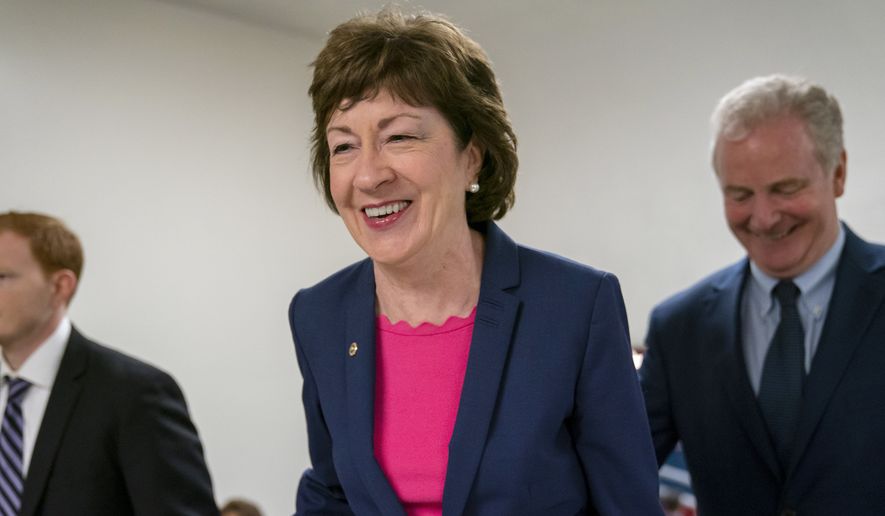 In this June 18, 2019, file photo, Sen. Susan Collins, R-Maine, center, arrives at the Capitol in Washington to extend her perfect Senate voting record to 7,000. National money is already flowing into Maines 2020 Senate race, offering the latest indicator that incumbent Collins faces a stiff reelection fight.  Maine House Speaker Sara Gideon, D-Freeport, is challenging Collins in the 2020 election. (AP Photo/J. Scott Applewhite, File)