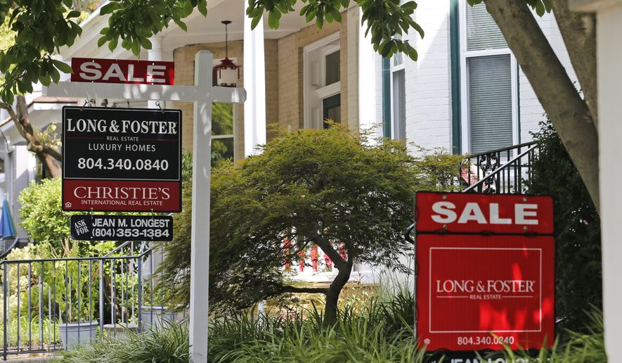 In this Friday, Aug. 16, 2019, photo for sale signs beckon buyers to homes along Park Avenue in Richmond, Va. On Wednesday, Aug. 21, the National Association of Realtors reports on sales of existing homes in July. (AP Photo/Steve Helber)
