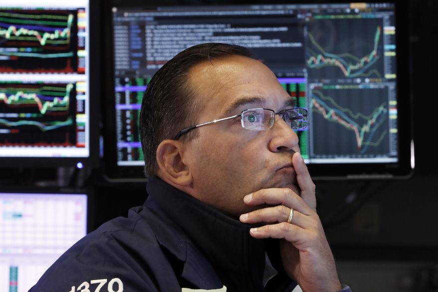 FILE - In this Aug. 16, 2019, file photo specialist Anthony Matesic works on the floor of the New York Stock Exchange. The U.S. stock market opens at 9:30 a.m. EDT on Wednesday, Aug. 21. (AP Photo/Richard Drew, File)