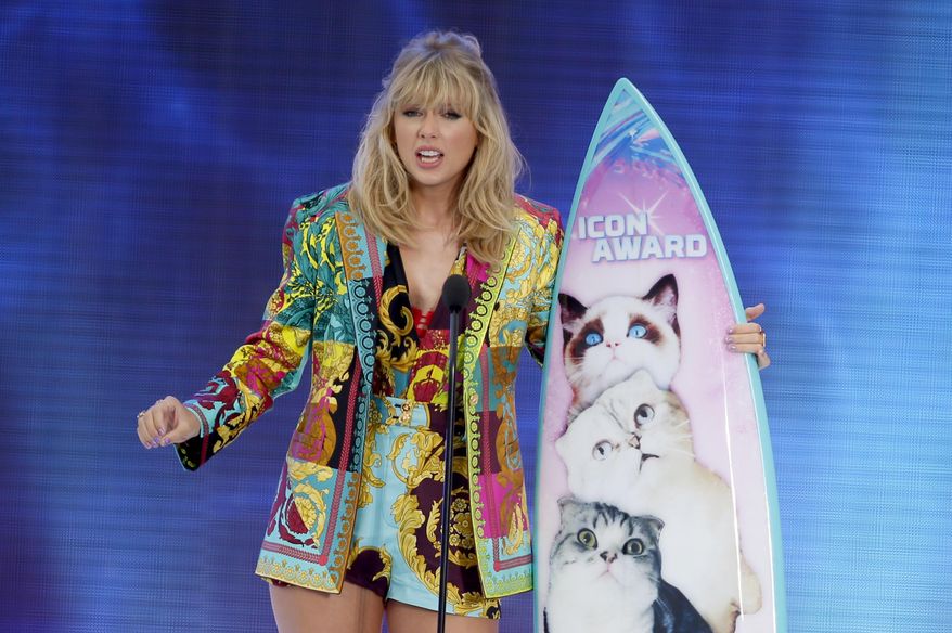 FILE - In this Aug. 11, 2019 file photo, Taylor Swift accepts the Icon award at the Teen Choice Awards in Hermosa Beach, Calif. Swift plans to re-record her songs after her catalog was purchased by popular music manager Scooter Braun. (Photo by Danny Moloshok/Invision/AP, File)