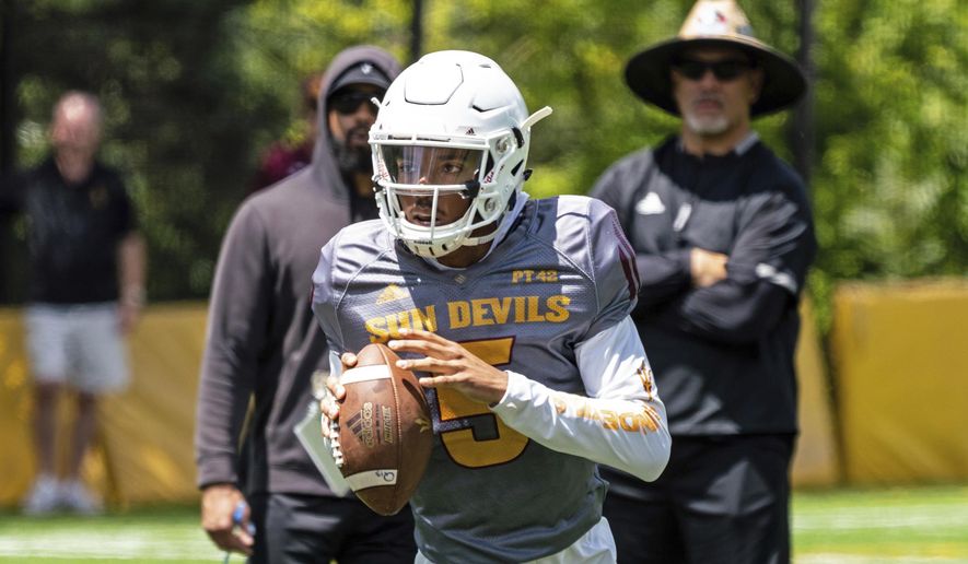 This Aug. 8, 2019, photo provided by Sun Devil Athletics shows Arizona State University freshman quarterback Jayden Daniels at practice in Payson, Ariz. Daniels will become the first Arizona State true freshman quarterback to start a season opener for the Sun Devils, as he won a four-man competition for the job. (Radmen Niven/Sun Devil Athletics via AP)