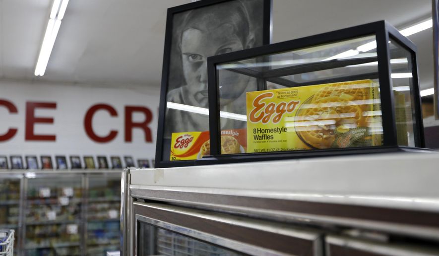 In this Monday, July 22, 2019 photo, a box of Eggo Homestyle Waffles used as a prop in Netflix&#x27;s Stranger Things sits atop a refrigerator in Piggly Wiggly grocery store in Palmetto, Ga. Stranger Things filmed scenes for seasons one and three at Piggly Wiggly, formerly known as Bradley&#x27;s Big Buy, including a scene in which a character steals boxes of waffles. (AP Photo/Andrea Smith)