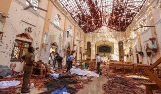 Dead bodies of victims lie inside St. Sebastian&#39;s Church damaged in blast in Negombo, north of Colombo, Sri Lanka, Sunday, April 21, 2019.  More than two hundred people were killed and hundreds more injured in eight blasts that rocked churches and hotels in and just outside Sri Lanka&#39;s capital on Easter Sunday. (AP Photo/Chamila Karunarathne)