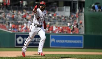 Washington Nationals&#39; Adam Eaton gestures as he celebrates his home run during the fifth inning of a baseball game against the Milwaukee Brewers, Sunday, Aug. 18, 2019, in Washington. The Nationals won 16-8. (AP Photo/Nick Wass) ** FILE **