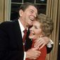 President Ronald Reagan embraces first lady Nancy Reagan on Jan. 30, 1984, in Washington, after he announced that he will run for a second term as President. Reagan, 72, confirmed that Vice President George Bush will again be his running mate in a campaign already well underway. (AP Photo/Ira Schwarz) ** FILE **