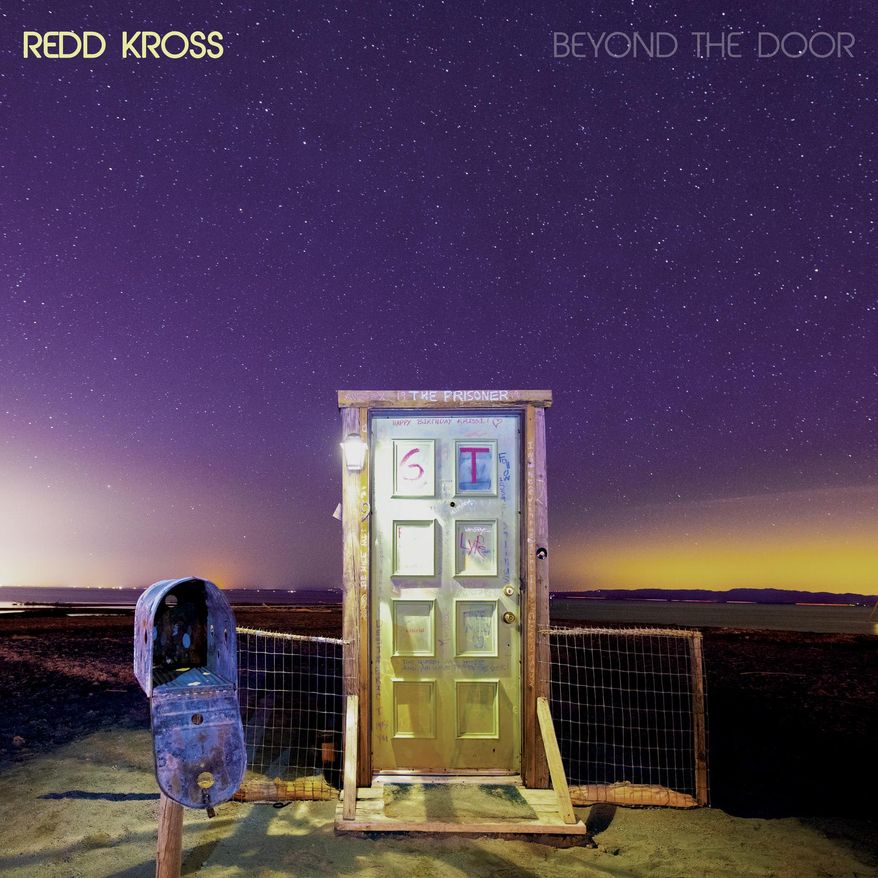 This photo provided by Merge Records shows the album cover of Redd Kross “Beyond The Door by Merge Records. Redd Kross continue to swing their pendulum widely and wildly between punk roots and power pop on “Beyond The Door,” their latest album arriving after seven lean years in terms of new recordings, but rich with live dates and reissues. (Merge Records via AP)