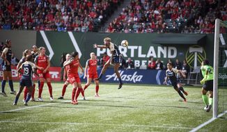 FILE - In this Sept. 22, 2018, file photo, North Carolina Courage&#39;s Jessica McDonald (14) heads the ball on goal during the team&#39;s NWSL soccer championship game against the Portland Thorns in Portland, Ore. Portland drew a league-record 25,218 fans to a game against the defending league champion North Carolina Courage earlier this month, evidence of a World Cup bump. In addition to bringing in new fans, players want sustained growth and stability. The key is investment. (Adam Lapierre/The Oregonian via AP, File)