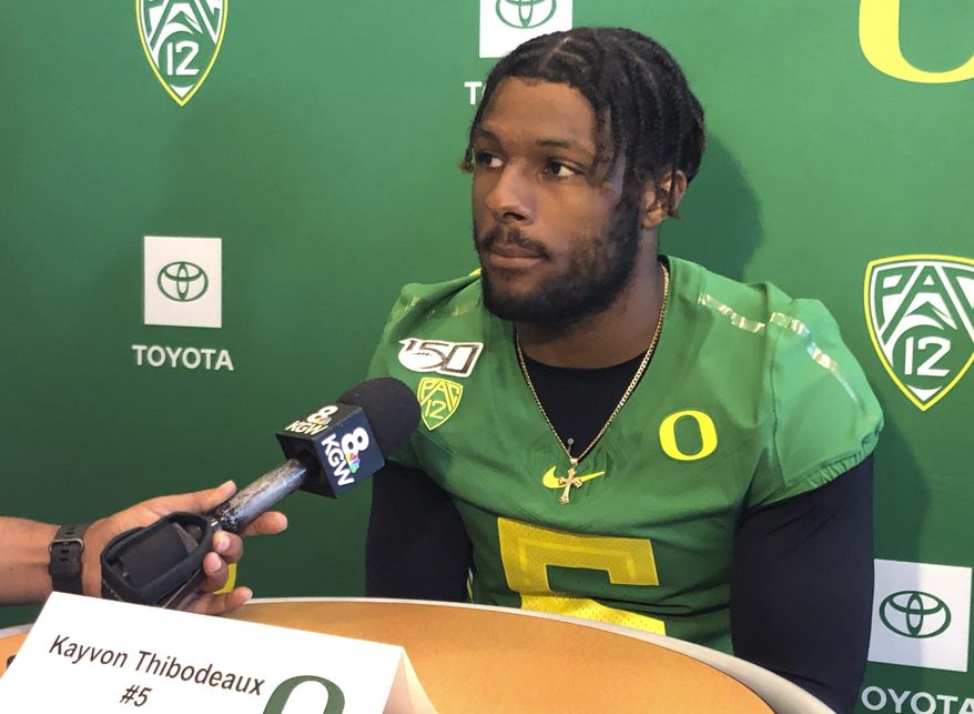 In this Aug. 2, 2019, photo, Oregon defensive end Kayvon Thibodeaux speaks to reporters at the NCAA college football team's media day in Eugene, Ore. Thibodeaux is a five-star recruit who should see playing time as a true freshman. (AP Photo/Anne M. Peterson)
