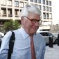 Greg Craig, former White House counsel to former President Barack Obama, walks into a federal courthouse for his trial, Thursday, Aug. 22, 2019, in Washington. (AP Photo/Patrick Semansky)