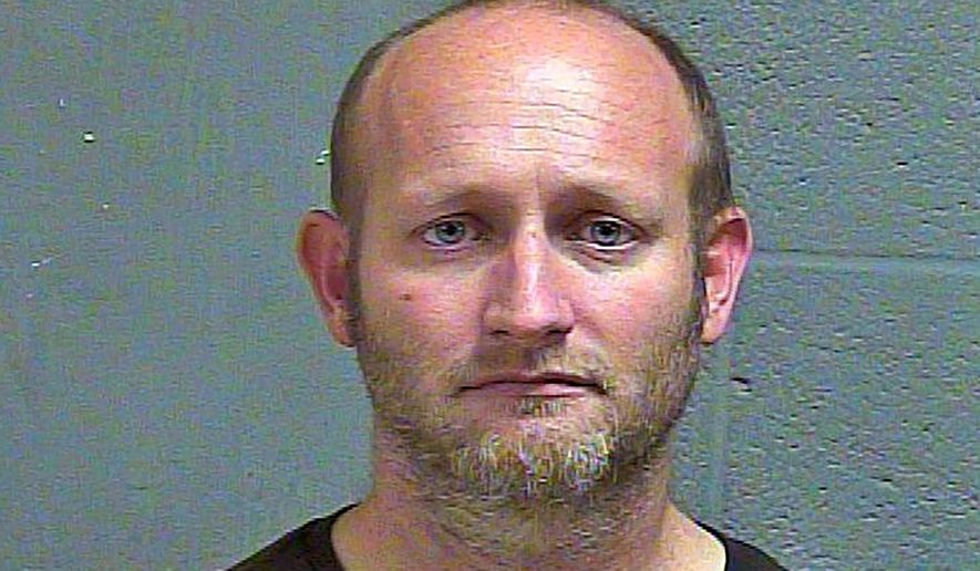 In this Nov. 1, 2018 booking photo provided by the Oklahoma County Sheriff's Office is Ryan Alden. A judge has sentenced Alden to life in prison for hiding cameras in four homes to capture images of girls. Alden pleaded guilty in June 2019 to 28 felonies, including creating child pornography and possession of obscene material of minors. (Oklahoma County Sheriff's Office via AP)