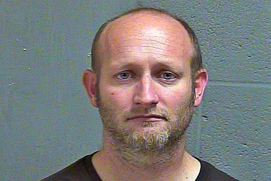 In this Nov. 1, 2018 booking photo provided by the Oklahoma County Sheriff's Office is Ryan Alden. A judge has sentenced Alden to life in prison for hiding cameras in four homes to capture images of girls. Alden pleaded guilty in June 2019 to 28 felonies, including creating child pornography and possession of obscene material of minors. (Oklahoma County Sheriff's Office via AP)