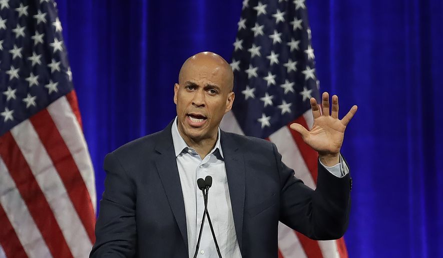 Democratic presidential candidate Sen. Cory Booker, D-N.J., gestures while speaking at the Democratic National Committee&#39;s summer meeting Friday, Aug. 23, 2019, in San Francisco. More than a dozen Democratic presidential hopefuls are making their way to California to curry favor with national party activists from around country. Democratic National Committee members will hear Friday from top contenders, including Elizabeth Warren, Kamala Harris and Bernie Sanders. (AP Photo/Ben Margot)