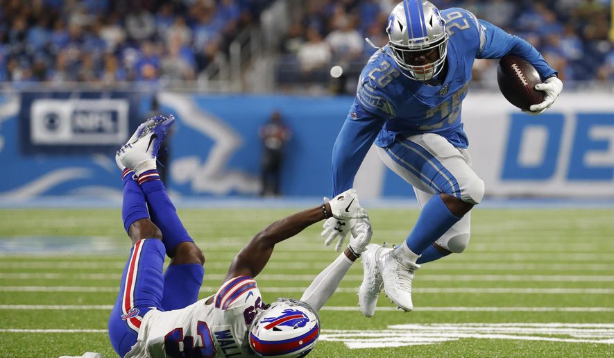 Detroit Lions running back C.J. Anderson (26) breaks the tackle of Buffalo Bills defensive back Levi Wallace (39) during the first half of an NFL preseason football game in Detroit, Friday, Aug. 23, 2019. (AP Photo/Rick Osentoski)