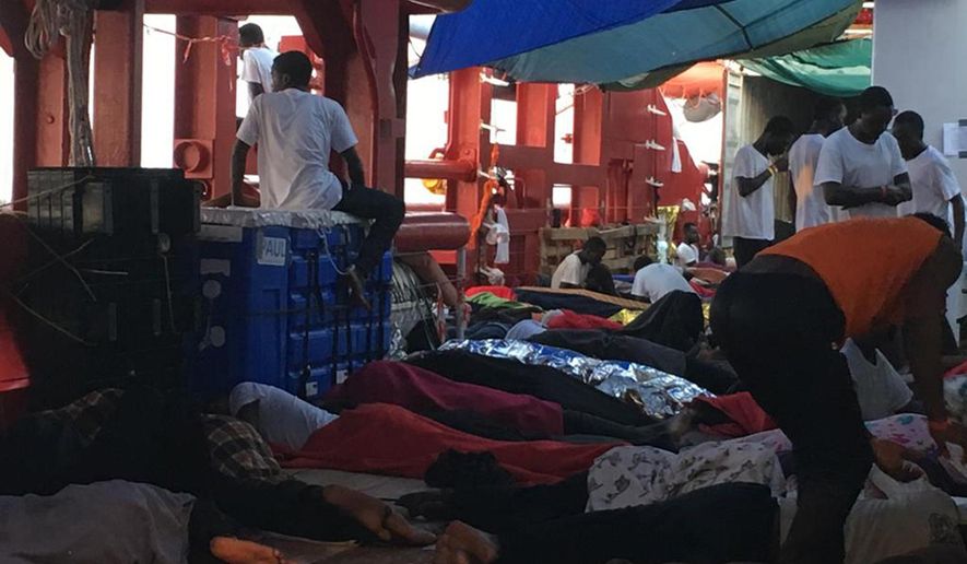 Rescued migrants sleep on the Ocean Viking, operated by SOS Mediterranee and MSF, as they cruise in the Mediterranean Sea, in the early hours of Friday, Aug. 23, 2019. Malta agreed Friday to disembark 356 migrants who were trapped for two weeks on the Ocean Viking, capping a week of standoffs between charities and governments that have exposed in dramatic ways Europe's inability to deal with migration from Africa. (Avra Fialas/SOS Mediterranee via AP)