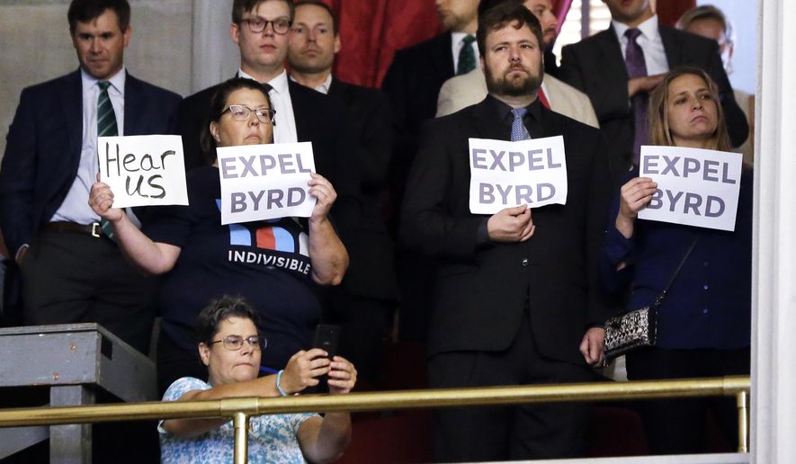 Demonstrators call for the expulsion of Rep. David Byrd, R-Waynesboro, during a special session of the House of Representatives Friday, Aug. 23, 2019, in Nashville, Tenn. Byrd is accused of sexual misconduct by three women nearly 30 years ago. (AP Photo/Mark Humphrey)