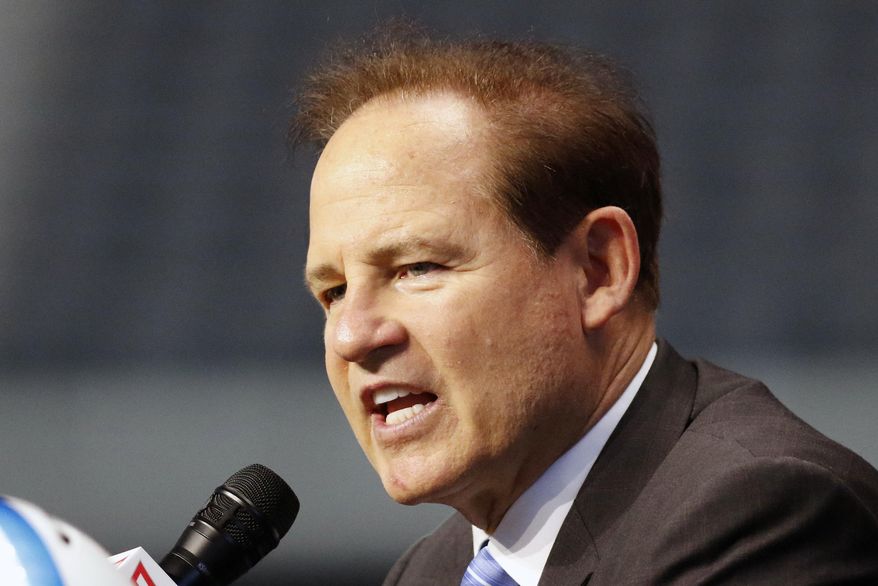 FILE - In this July 15, 2019, file photo, Kansas head coach Les Miles speaks on the first day of Big 12 Conference NCAA college football media days in Arlington, Texas. Les Koenning has to be careful every time the new offensive coordinator at Kansas walks into one of the Jayhawks’ meeting rooms, making sure to address the right person by the right name. There’s Miles Kendrick and Miles Fallin, Manny Miles and Ben Miles. Throw in new coach Les Miles and you have miles and miles of Miles in Lawrence these days. (AP Photo/David Kent, File)