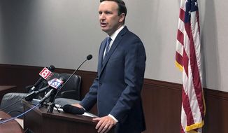 U.S. Sen. Chris Murphy speaks during a news conference, Friday, Aug. 23, 2019, in Hartford, Conn. Murphy said White House officials told him on Thursday that President Donald Trump remains committed to working on expanded background checks legislation for gun purchases. (AP Photo/Susan Haigh)