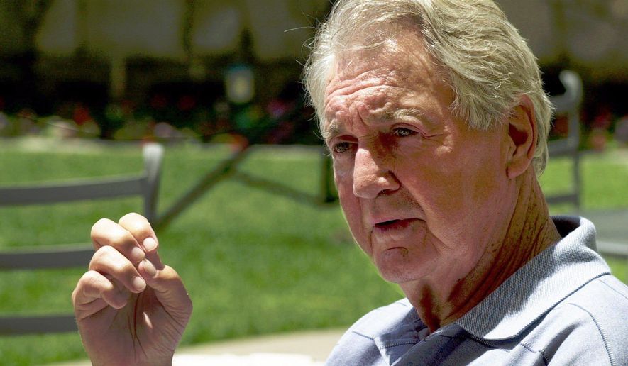 FILE - In this July 24, 2000, file photo, Pat Summerall, lead play-by-play announcer for the NFL on Fox Sports, announces his retirement during a news conference in the Century City section of Los Angeles. Summerall transitioned from a successful playing career to the booth in the 1960s and became the voice of the NFL. He started off as an analyst and was part of the first Super Bowl. He shifted to a play-by-play role in 1974 at CBS and that is where he really shined. (AP Photo/Nick Ut, File)
