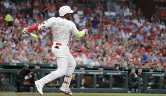 St. Louis Cardinals&#39; Marcell Ozuna watches his two-run home run during the first inning of the team&#39;s baseball game against the Colorado Rockies on Friday, Aug. 23, 2019, in St. Louis. (AP Photo/Jeff Roberson)