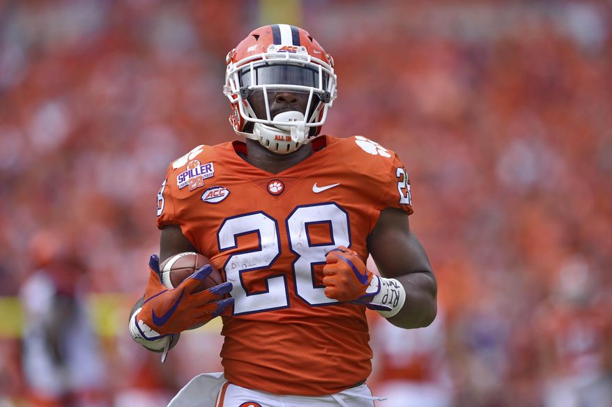 FILE - In this Sept. 29, 2018, file photo, then-Clemson's Tavien Feaster rushes up the field during the first half of an NCAA college football game against Syracuse in Clemson, S.C. South Carolina tailback Rico Dowdle leads a running game featuring three seniors and Clemson graduate transfer Tavien Feaster, who switched sides after three years and two national championship rings with the Tigers. (AP Photo/Richard Shiro, File)