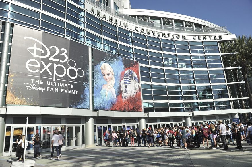 People line up in front of the Anaheim Convention Center during the 2019 D23 Expo on Saturday, Aug. 24, 2019, in Anaheim, Calif. (Photo by Richard Shotwell/Invision/AP)