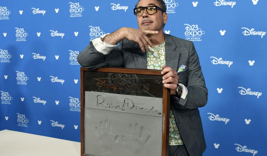Actor Robert Downey Jr. poses during his handprint ceremony at the Disney Legends press line during the 2019 D23 Expo, Friday, Aug. 23, 2019, in Anaheim, Calif. (Photo by Chris Pizzello/Invision/AP)