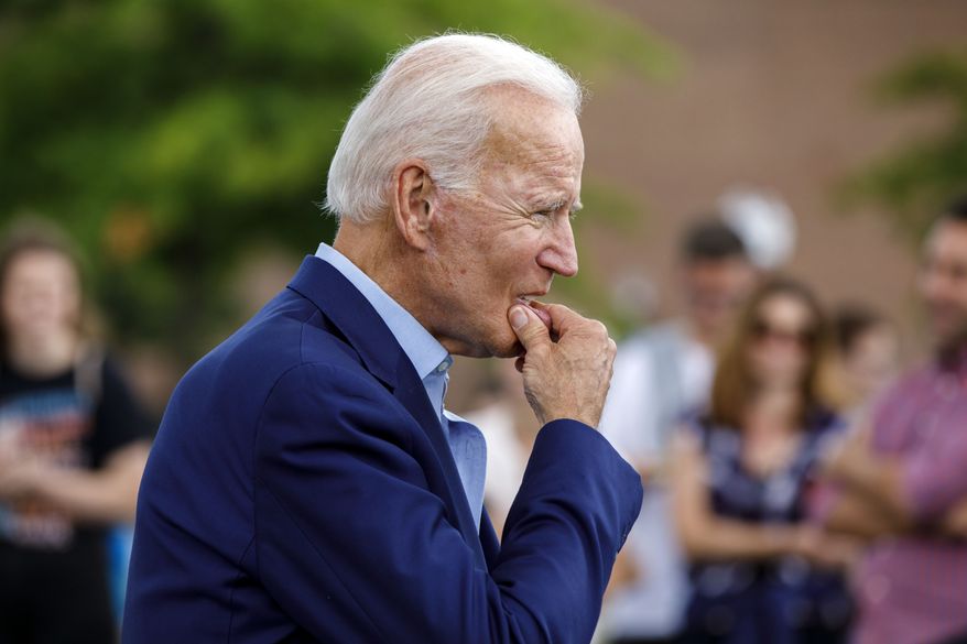 Democratic presidential candidate former Vice President Joe Biden approaches reporters to answer questions following a campaign stop at Lindy's Diner in Keene, N.H., Saturday, Aug. 24, 2019. (AP Photo/Michael Dwyer)