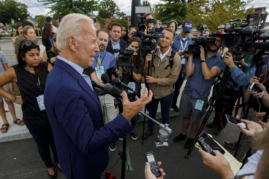 Democratic presidential candidate former Vice President Joe Biden speaks to reporters after a campaign stop at Lindy's Diner in Keene N.H., Saturday, Aug. 24, 2019. (AP Photo/Michael Dwyer)