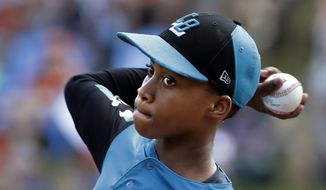 Curacao&#39;s Shendrion Martinus (6) delivers in the second inning of the International Championship baseball game against Japan at the Little League World Series tournament in South Williamsport, Pa., Saturday, Aug. 24, 2019. (AP Photo/Gene J. Puskar)