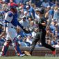 Washington Nationals&#39; Trea Turner, right, scores against the Chicago Cubs on a sacrifice fly hit by Washington Nationals&#39; Anthony Rendon during the first inning of a baseball game, Saturday, Aug. 24, 2019, in Chicago. (AP Photo/Kamil Krzaczynski)