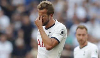 Tottenham&#39;s Harry Kane, left is dejected after missing an opportunity to score during the English Premier League soccer match between Tottenham Hotspur and Newcastle United at Tottenham Hotspur Stadium in London, Sunday, Aug. 25, 2019.(AP Photo/Frank Augstein)