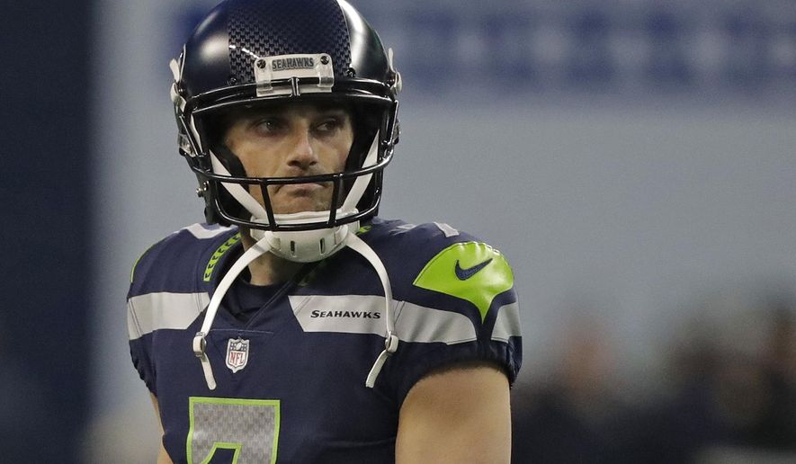 FILE - In this Dec. 31, 2017 file photo Seattle Seahawks kicker Blair Walsh reacts after he missed a field goal at the end of an NFL football game against the Arizona Cardinals in Seattle. The Atlanta Falcons have brought in Walsh to compete for their kicking job. Walsh was at practice Sunday, Aug. 25, 2019 and will get a shot to beat out Giorgio Tavecchio, who’s made only four of eight field goal attempts during the preseason. (AP Photo/Elaine Thompson, file)