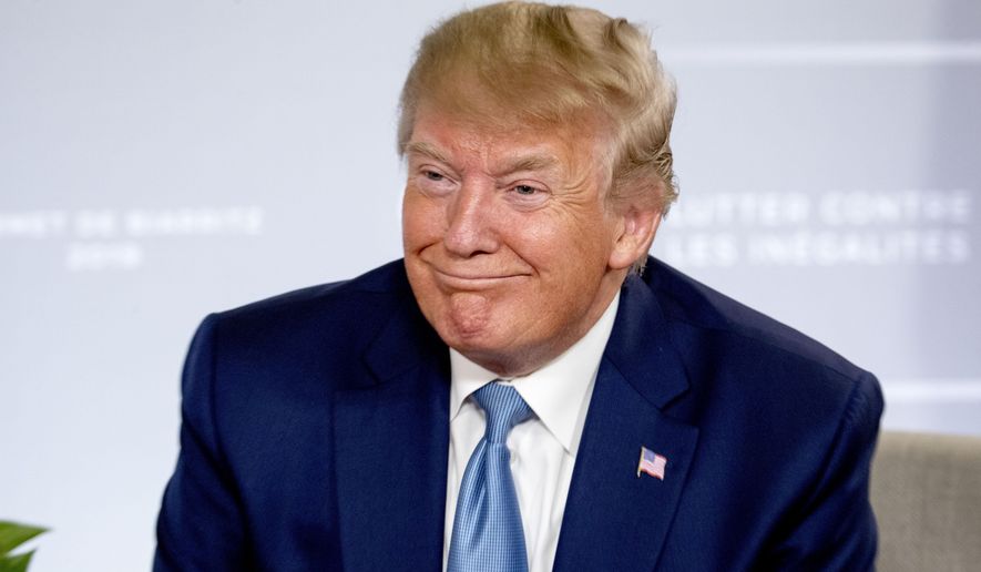 U.S President Donald Trump smiles during a news conference with Japanese Prime Minister Shinzo Abe at the G-7 summit in Biarritz, France, Sunday, Aug. 25, 2019, where they announced that the U.S. and Japan have agreed in principle on a new trade agreement. (AP Photo/Andrew Harnik)