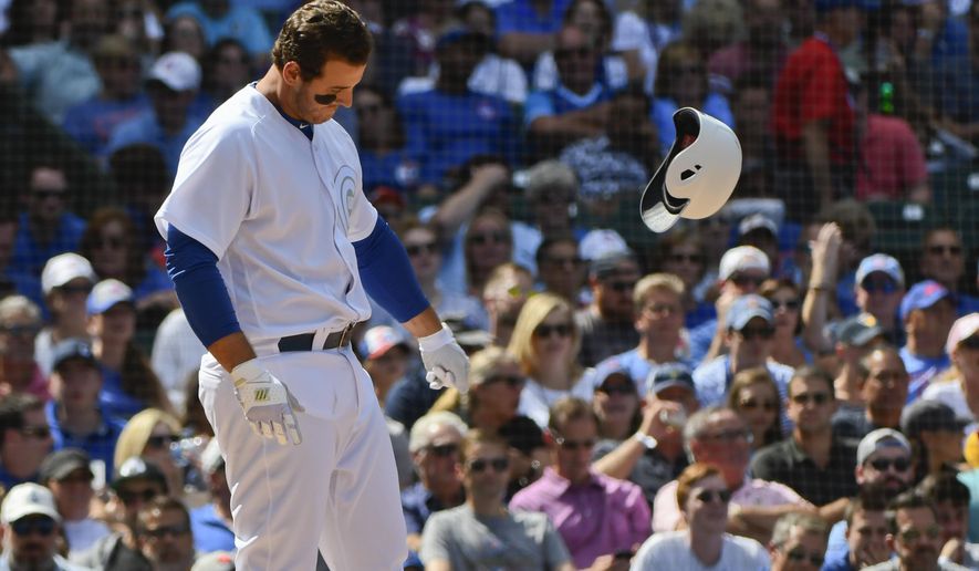 Chicago Cubs' Anthony Rizzo throws his helmet after striking out swinging during the fourth inning of a baseball game against the Washington Nationals, Friday, Aug. 23, 2019, in Chicago. (AP Photo/Matt Marton)