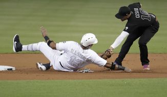Miami Marlins&#39; Starlin Castro (13) is tagged out by Philadelphia Phillies second baseman Cesar Hernandez (16) while trying to stealing second during the first inning of a baseball game Sunday, Aug. 25, 2019, in Miami. (AP Photo/Lynne Sladky)