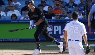 New York Yankees&#39; Aaron Judge, left, runs to first as he hits a solo home run as Los Angeles Dodgers starting pitcher Clayton Kershaw watches during the third inning of a baseball game Sunday, Aug. 25, 2019, in Los Angeles. (AP Photo/Mark J. Terrill)