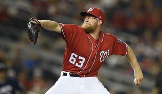 Washington Nationals relief pitcher Sean Doolittle delivers a pitch during a baseball game against the Milwaukee Brewers, Saturday, Aug. 17, 2019, in Washington. (AP Photo/Nick Wass) ** FILE **