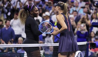 Serena Williams, left, shakes hands with Maria Sharapova after their first-round match at the U.S. Open tennis tournament in New York, Monday, Aug. 26, 2019. Williams won. (AP Photo/Charles Krupa)