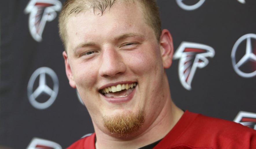 FILE - In this May 10, 2019, file photo, Atlanta Falcons offensive lineman Kaleb McGary speaks to the media after NFL football rookie camp in Flowery Branch, Ga. The Falcons' offensive line remains a work in progress. Having rookie first-round pick Kaleb McGary again cleared for contact following a heart procedure may help. (AP Photo/Tami Chappell, File)