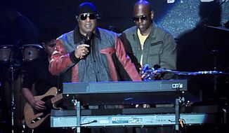 Musician Stevie Wonder, front left, and comedian Dave Chappelle appear on stage during the &amp;quot;Gem City Shine,&amp;quot; event in the Oregon District in Dayton, Ohio, Sunday, Aug. 25, 2019. Chappelle, who resides in nearby Yellow Springs, hosted the special block party and benefit concert for those affected by the recent mass shooting. (Marshall Gorby/Dayton Daily News via AP)