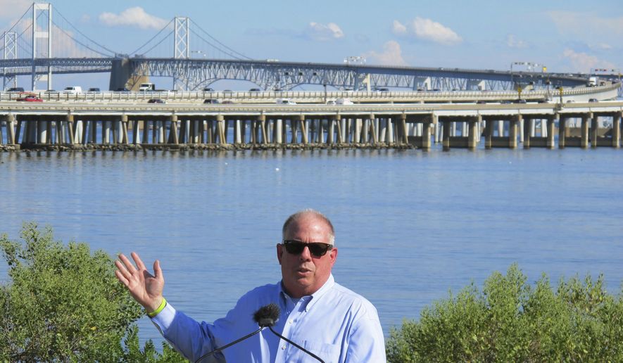  In this Tuesday, Aug. 30, 2016, file photo, Gov. Larry Hogan speaks at a news conference near Annapolis, Md., with the Chesapeake Bay Bridge in the backdrop. In an announcement Tuesday, Aug. 27, 2019, Maryland transportation officials said they have narrowed the possibilities for a new crossing over the Chesapeake Bay to three areas near the current Bay Bridge. (AP Photo/Brian Witte, File)  **FILE**