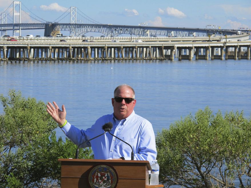 In this Tuesday, Aug. 30, 2016, file photo, Gov. Larry Hogan speaks at a news conference near Annapolis, Md., with the Chesapeake Bay Bridge in the backdrop. In an announcement Tuesday, Aug. 27, 2019, Maryland transportation officials said they have narrowed the possibilities for a new crossing over the Chesapeake Bay to three areas near the current Bay Bridge. (AP Photo/Brian Witte, File) **FILE**
